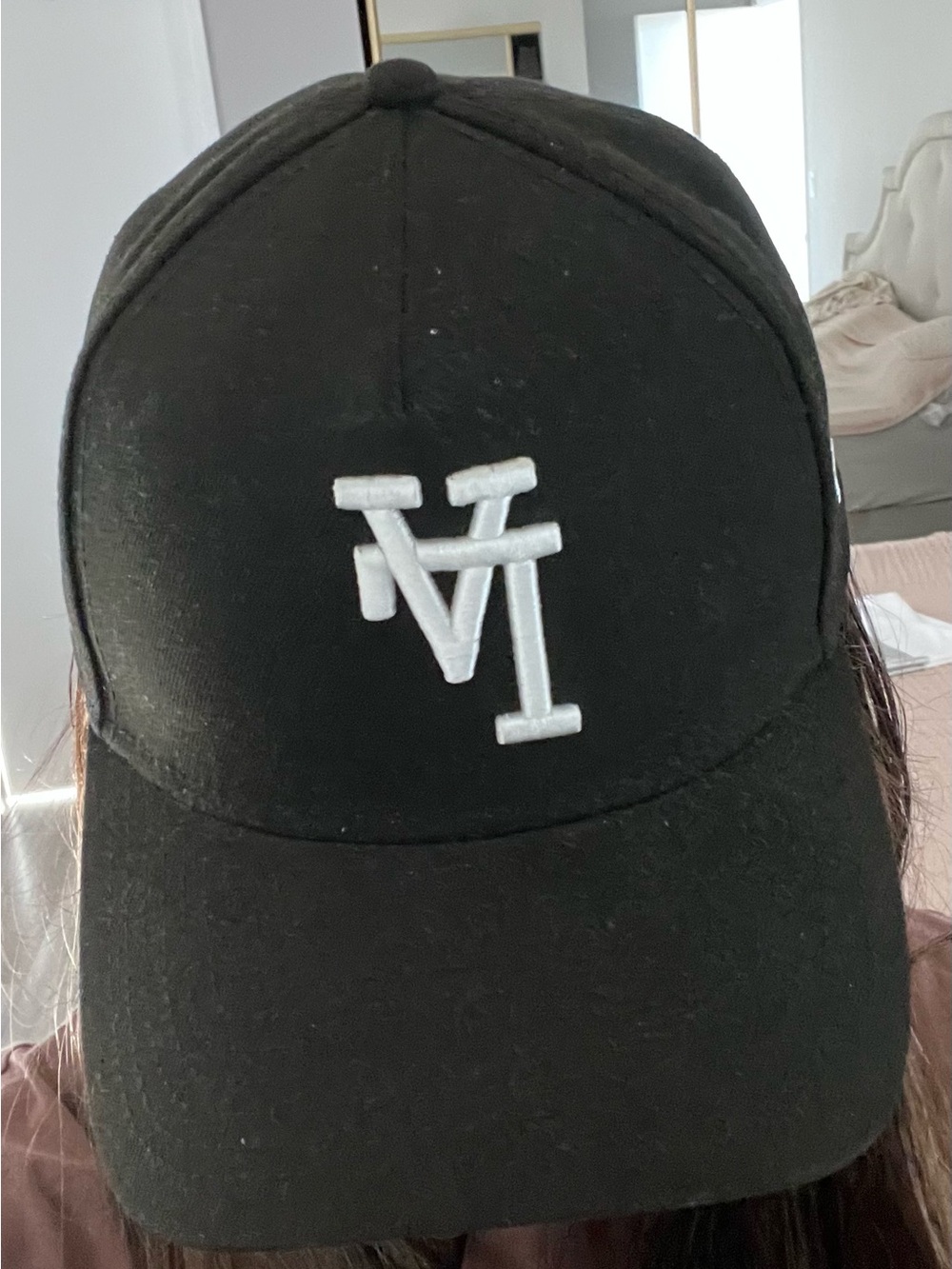 New Era Black Baseball Cap with White Embroidered Logo